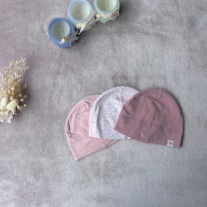 Lot , d'occasione trois bonnets H&M 50/56 cm en coton : deux roses unis et un rose imprimé fleuri.
