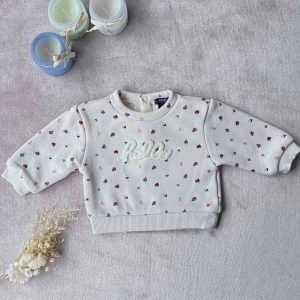 Pull bébé blanc Kiabi taille 1 mois, avec petits motifs fleuris et inscription “Hello” en relief, d'occasion