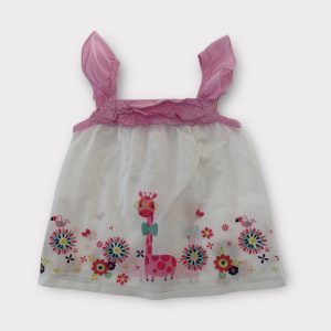 Blouse bébé fille blanc et rose sans manches, avec motif girafe colorée et fleurs, devant froncé, ouverture dos. Seconde main.