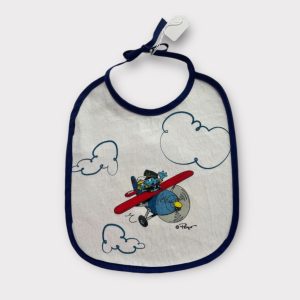 Bavoir bébé blanc avec biais bleu marine, illustration Schtroumpf pilote d’avion et nuages, attache à nouer, d'occasion