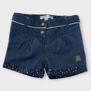 Short bébé effet jean bleu avec boutons dorés, revers à motifs colorés et détails dorés à la taille. Lulu Castagnette, 6 mois d'occasion