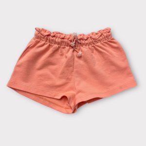 Short bébé abricot taille élastiquée et cordon de serrage. Seconde main.