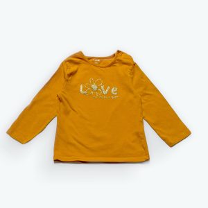 T-shirt bébé mangue, manches longues avec une sérigraphie "LOVE". Seconde main.
