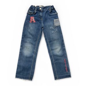 Pantalon enfant jean avec empiècements décoratifs et broderies. Seconde main.
