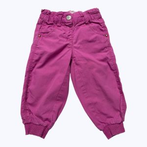 Pantalon bébé rose smocké aux chevilles. Seconde main.