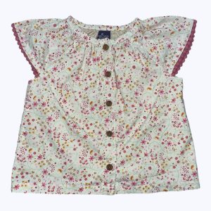 Blouse bébé doublée manches courtes crème avec des motifs répétés petites fleurs. Seconde main.
