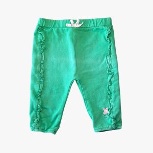 Pantalon de jogging bébé vert avec volants sur les côtés et petite fleur brodée. Mots d'Enfants, 9 mois d'occasion