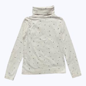 T-shirt enfant manches longues blanc avec des petits motifs noirs et un col roulé. Seconde main.
