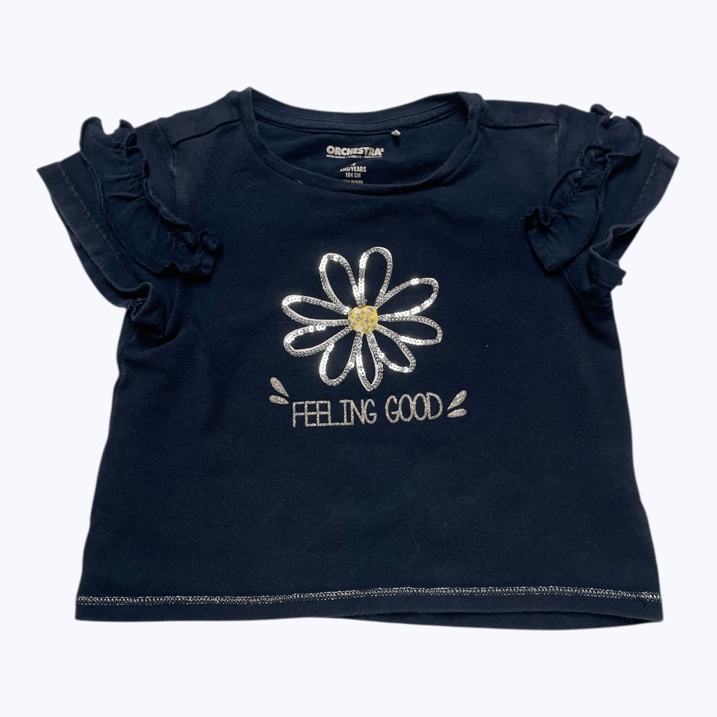 T shirt enfant bleu marine manches courtes volantées avec un imprimé et une broderie centrale argentée. Seconde main.