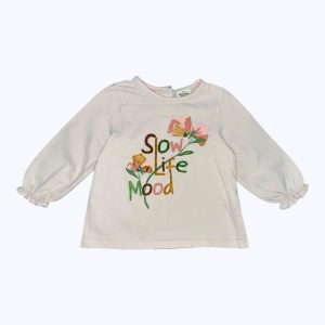 T-shirt bébé manches longues crème dessin fleur devant, élastiqué aux poignets. Seconde main.