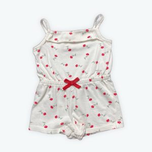 Combishort bébé bretelles crème motif répété fleurs rouge et vert, élastique à la taille. Seconde main.