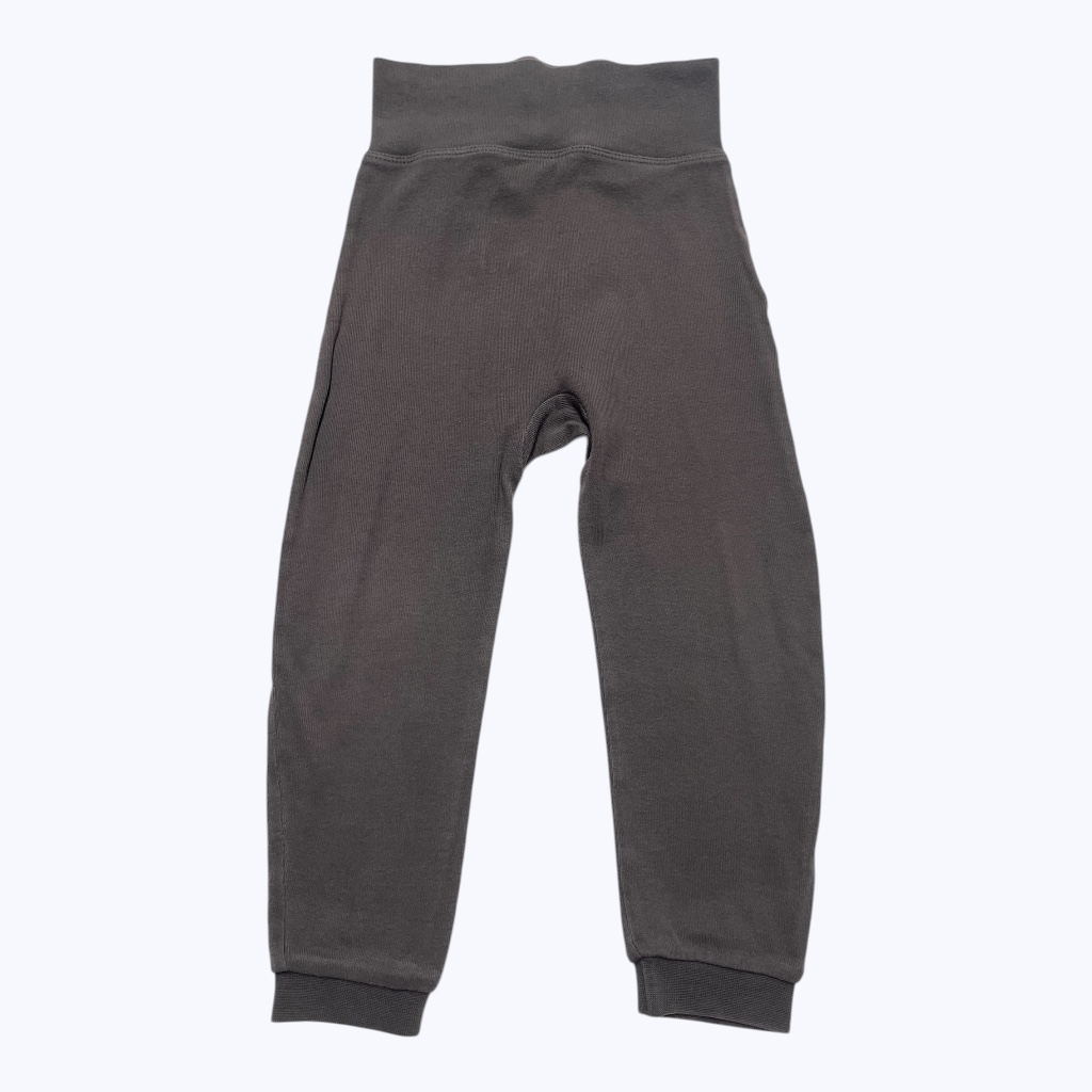 Pantalon bébé marron élastique large à la taille dessin dinosaure aux fesses. Seconde main.
