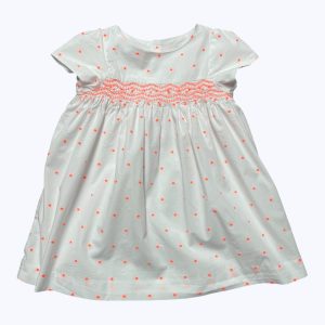 Robe bébé manches courtes blanches pois orange fluo ouverture centrale dos entièrement doublée.