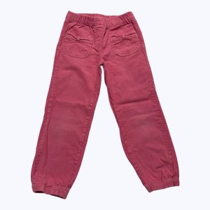 Pantalon enfant velours fines côtes rose, taille et chevilles élastiquées. Seconde main.