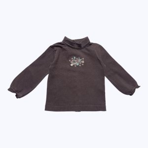T-shirt bébé manches longues col roulé chocolat, maille piquée broderie fleurs rose turquoise devant, ouverture centrale dos. Seconde main.