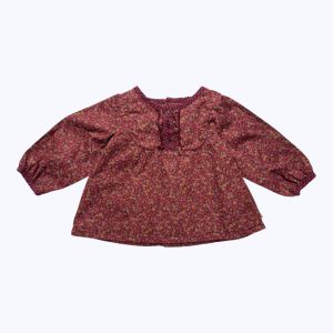 Blouse bébé manches longues terracotta élastiquée aux poignets, imprimé petites fleurs rose rouge crème, ouverture centrale dos. Seconde main.