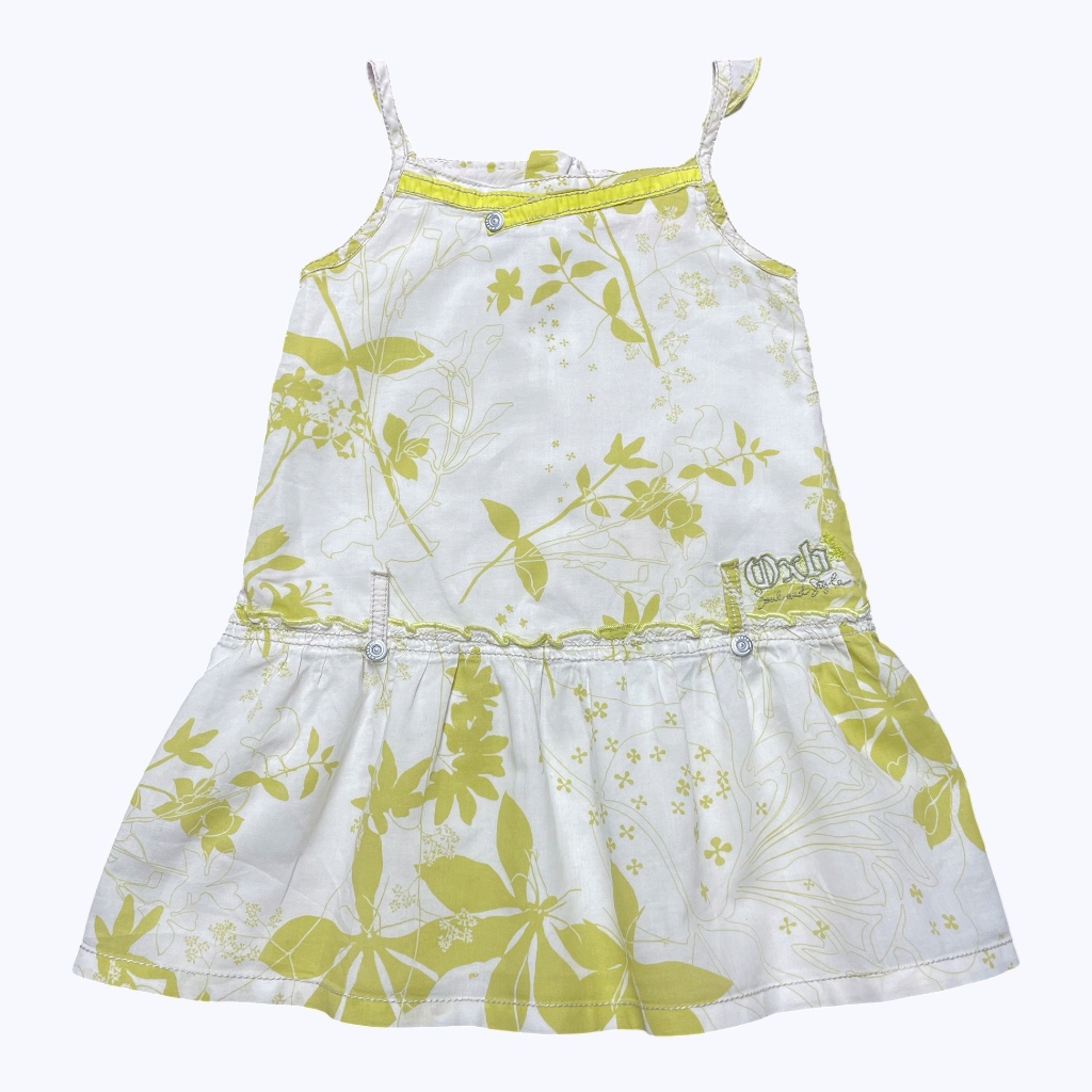 Robe bébé bretelles blanche à motifs floral vert anis, zippée au dos. Seconde main.